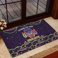 Black rubber Mardi Gras doormat with mask graphic, beads garland, “BREAUX”
