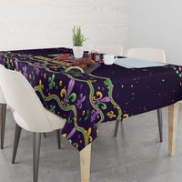 Mardi Gras tablecloth on rectangular dining table with purple and green ornamental print