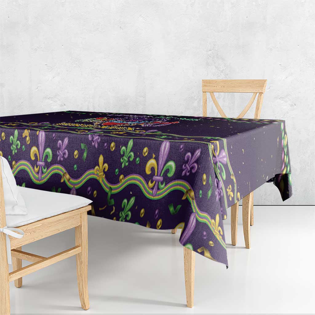 Purple Mardi Gras tablecloth with green-gold ornamental border and scalloped edge