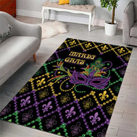 Geometric area rug with purple mask, green and gold accents, and fleur-de-lis pattern