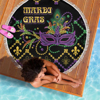 Round black beach blanket with Mardi Gras mask and swirl bead pattern, white fringe border