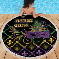 Round black beach blanket with colorful Mardi Gras mask print and fleur-de-lis bead pattern