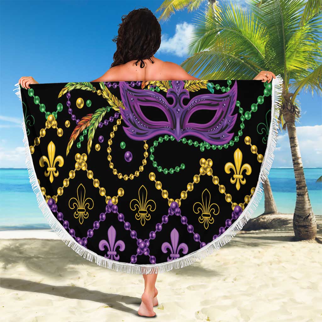 Round black beach blanket with purple Mardi Gras mask, green purple yellow beads, white fringe