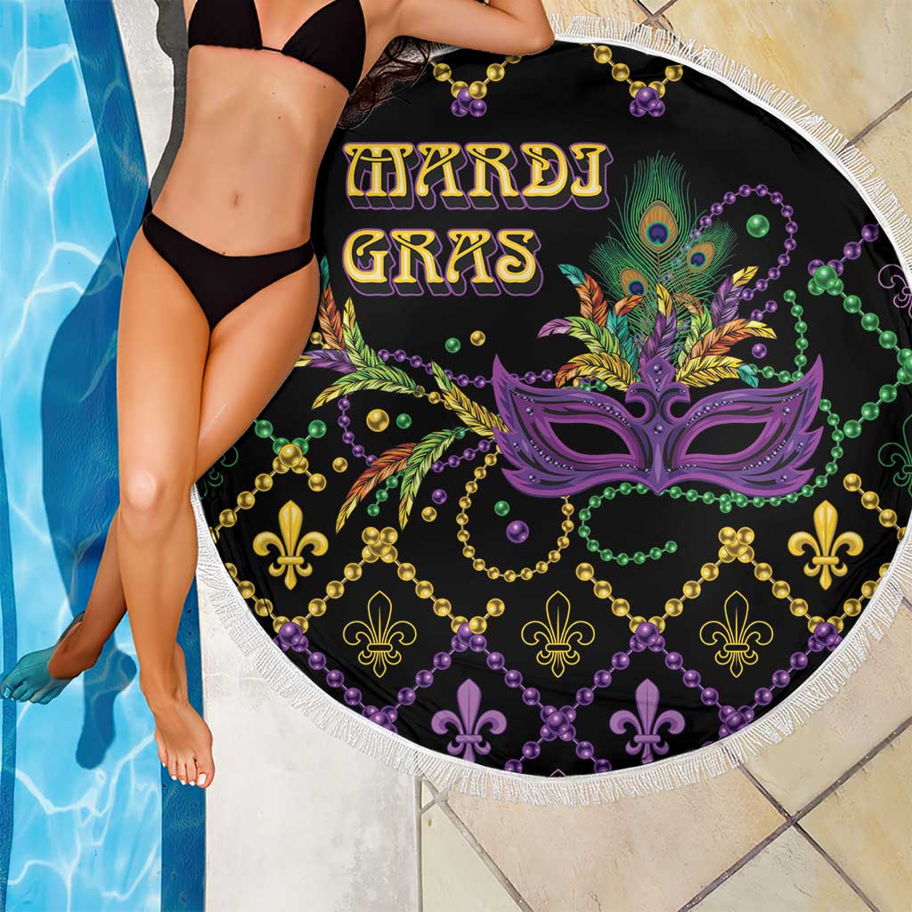 Round black beach blanket with Mardi Gras mask and bead swirl pattern, white fringe border