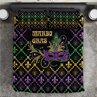 Geometric Mardi Gras bedding set with purple, green, and gold fleur-de-lis pattern and mask