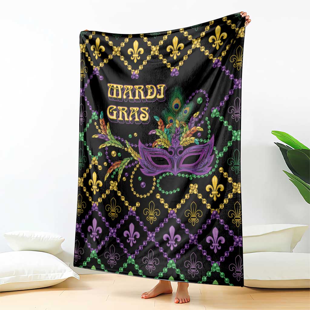 Black geometric blanket held upright with purple Mardi Gras mask, fleur-de-lis, 'MARDI GRAS'.