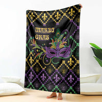 Black geometric blanket held upright with purple Mardi Gras mask, fleur-de-lis, 'MARDI GRAS'.
