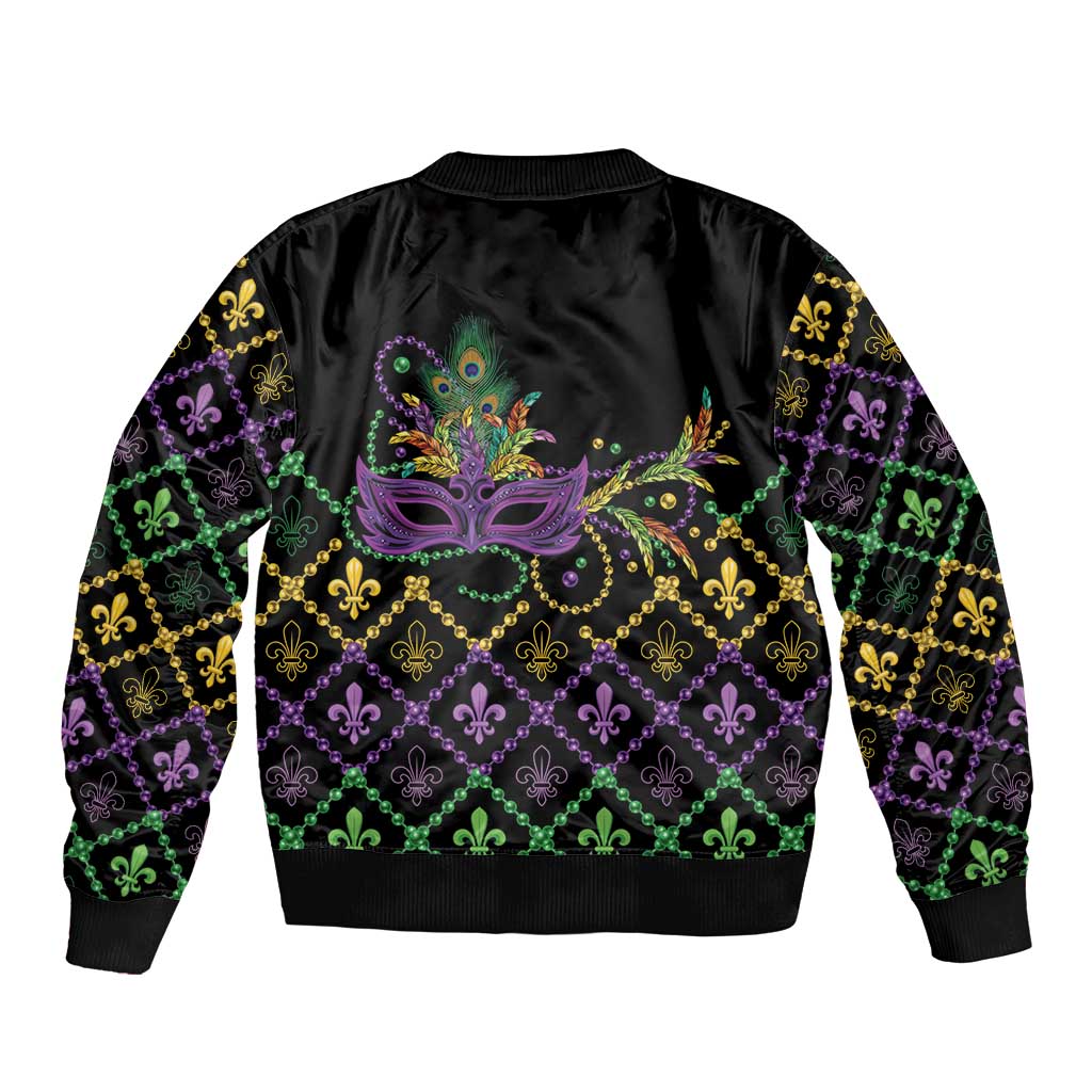 Black unisex bomber jacket with central Mardi Gras mask design and fleur-de-lis hem