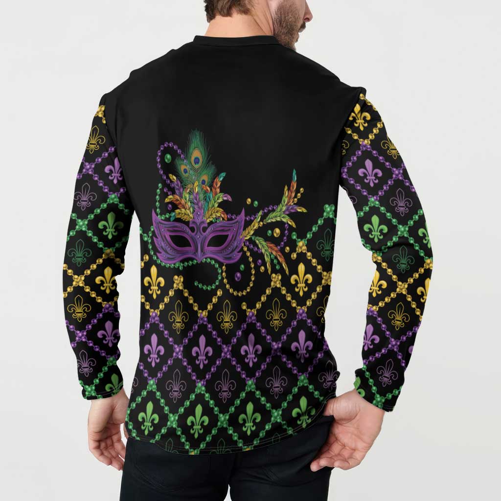 Black button sweatshirt back print with peacock mask and fleur-de-lis bead chain pattern.