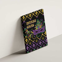 Mardi Gras canvas wall art angled against wall, purple mask and 'Mardi Gras' lettering on black