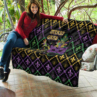 Mardi Gras quilt draped outdoors, black with purple, green and gold fleur-de-lis and mask