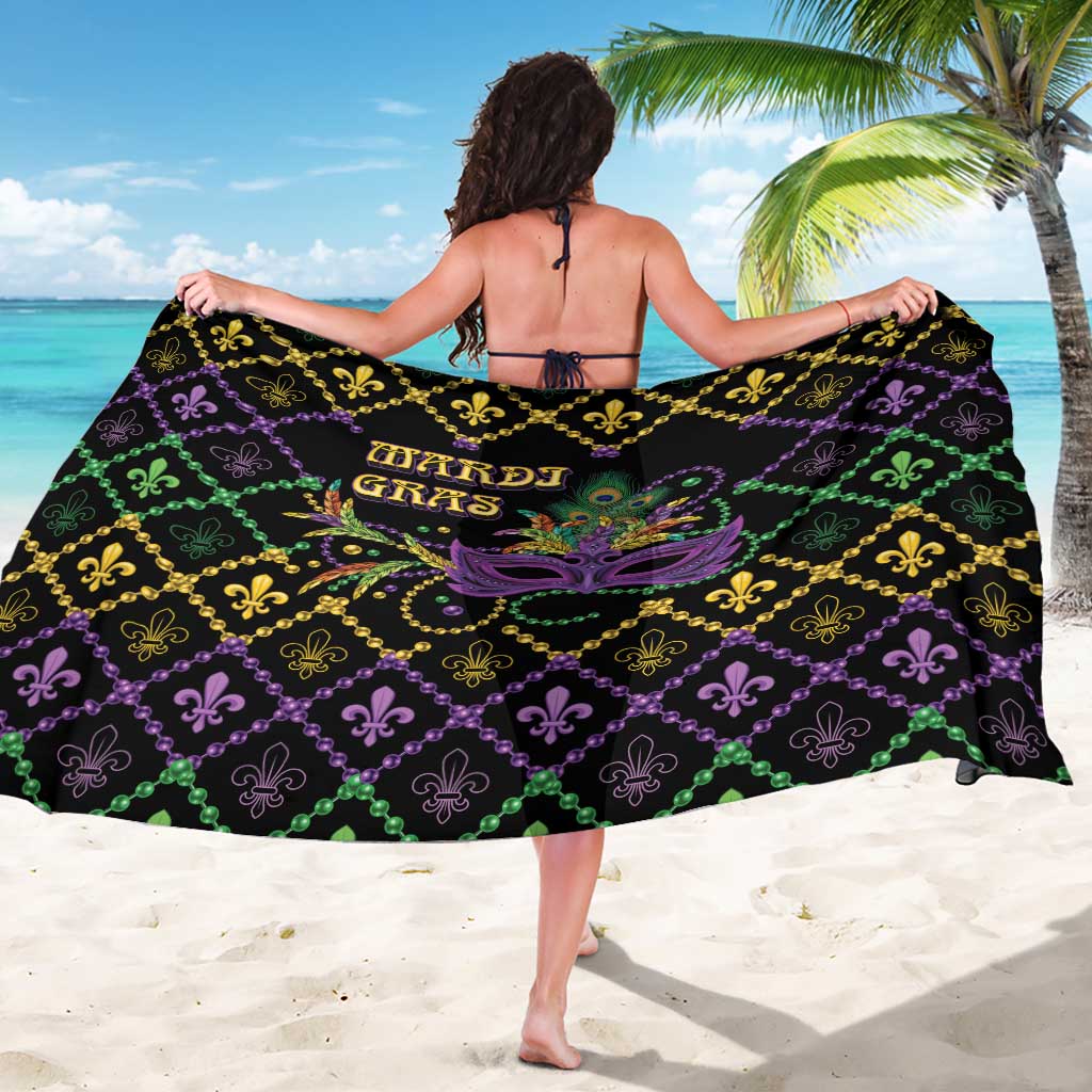 Black Mardi Gras sarong with fleur-de-lis lattice and purple mask design, draped wide