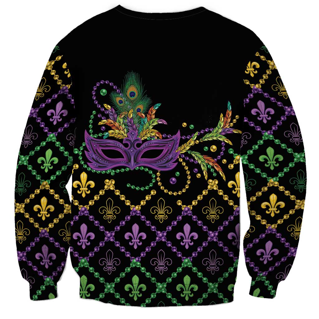 Black unisex crewneck sweatshirt with central purple Mardi Gras mask and fleur-de-lis grid