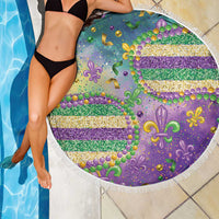 Round purple beach blanket with glitter fleur-de-lis and striped bead pattern, white fringe