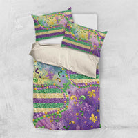 Purple duvet and two pillowcases with fleur-de-lis glitter bead accents and gold-green horizontal stripes