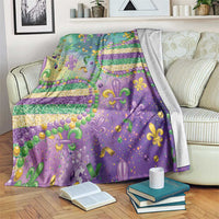 Purple Mardi Gras blanket with fleur-de-lis motifs, glitter beads, and gold confetti stripes