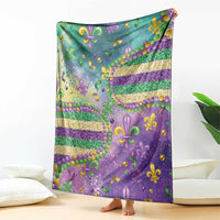 Mardi Gras blanket draped vertically in teal and purple with fleur-de-lis glitter bead details
