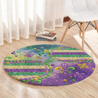 Round Mardi Gras glitter carpet in purple with fleur-de-lis, bead trim, and rainbow stripe bands