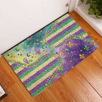 Purple rubber doormat with glitter bead border, fleur de lis motifs, and multi-color stripes