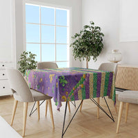 Purple Mardi Gras fleur de lis tablecloth with glitter beaded pattern on dining table