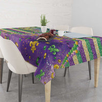 Purple Mardi Gras fleur de lis tablecloth with glitter beaded pattern draped on table