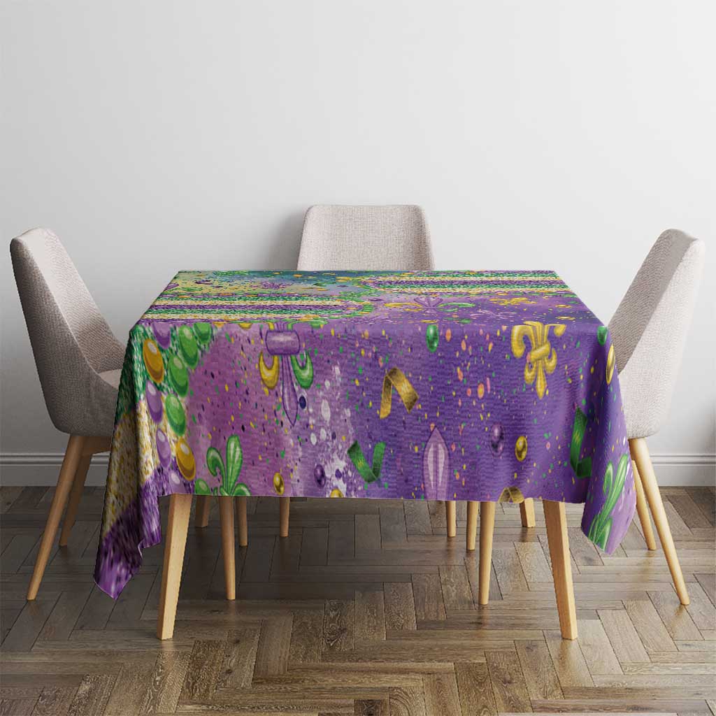 Purple Mardi Gras fleur de lis tablecloth with glitter beaded pattern on dining table