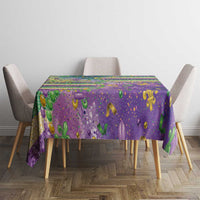 Purple Mardi Gras fleur de lis tablecloth with glitter beaded pattern on dining table