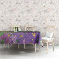 Purple Mardi Gras fleur de lis tablecloth with glitter beaded pattern on table