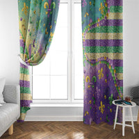 Hanging window curtain with purple, teal, and green fleur de lis pattern plus gold horizontal stripes.