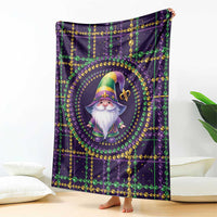 Mardi Gras gnome blanket with centered gnome in hat, green and gold beads on dark purple