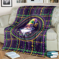 Mardi Gras gnome blanket draped on sofa, dark purple with green and gold bead borders