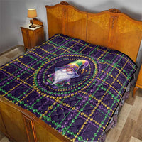 Purple quilt on bed with gnome medallion, fleur-de-lis motifs, green and gold bead lines