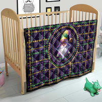 Purple quilt for baby crib with gnome emblem in circle, green and gold bead pattern