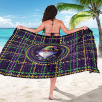 Mardi Gras gnome sarong, back view with circular gnome emblem and green gold bead rows