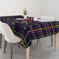 Mardi Gras tablecloth corner with purple geometric print and green bead garland trim