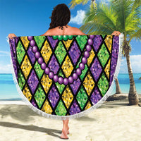 Round beach blanket held up with multicolor bead garlands and diamond pattern, white fringe trim
