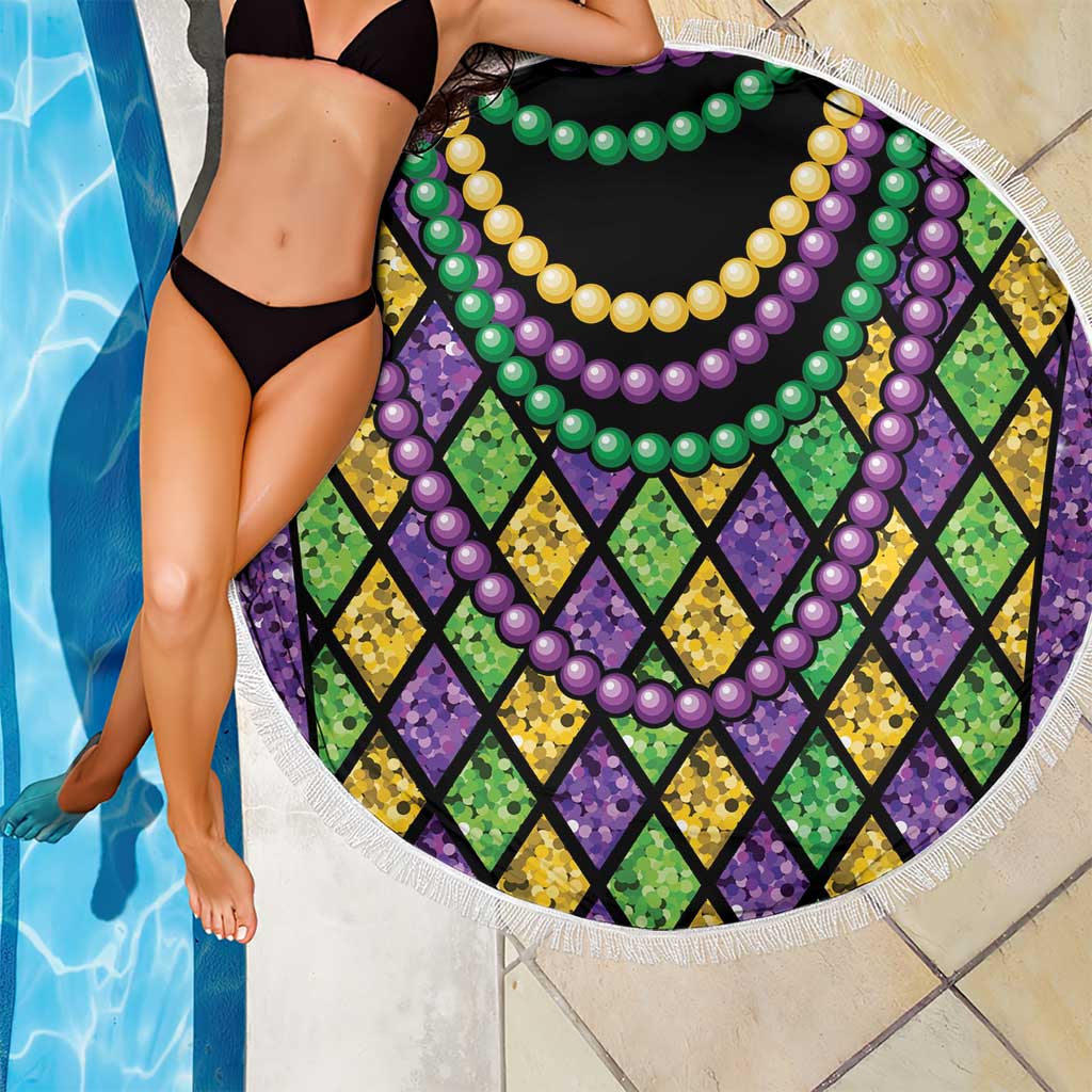 Round beach blanket close-up with purple green yellow bead garlands and multicolor diamond pattern