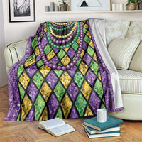 Mardi Gras beads blanket with purple, green and yellow diamond pattern and bead garlands