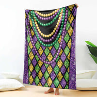 Beads blanket draped over sofa, purple and green diamond pattern with multi-color bead strands
