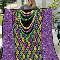 Purple Mardi Gras strings of beads quilt with black center and bead-like necklace rows