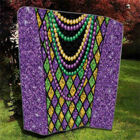 Purple Mardi Gras strings of beads quilt draped view with black panel and green bead strands