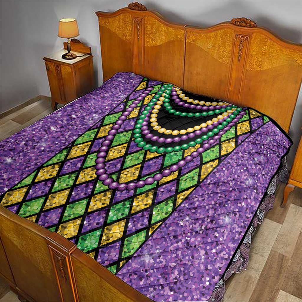 Purple Mardi Gras strings of beads quilt on bed with black center and multi-color bead necklaces