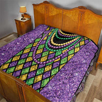 Purple Mardi Gras strings of beads quilt on bed with black center and multi-color bead necklaces
