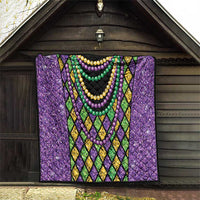 Purple Mardi Gras strings of beads quilt front view with diamond lattice trim and bead garlands