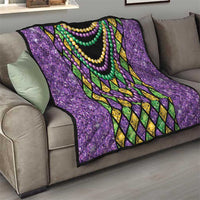 Purple Mardi Gras strings of beads quilt on sofa with black center and diamond lattice trim