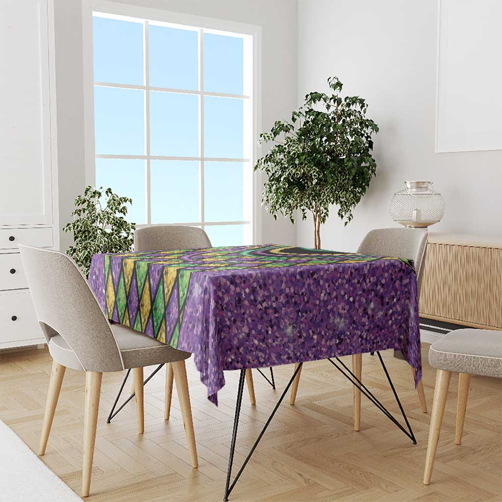 Purple Mardi Gras tablecloth with glitter texture, diamond panel pattern, and bead-necklace detail