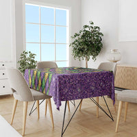 Purple Mardi Gras tablecloth with glitter texture, diamond panel pattern, and bead-necklace detail