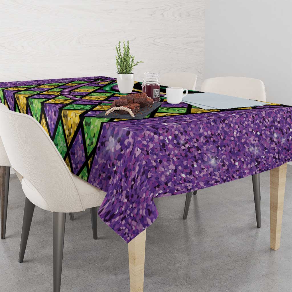 Glitter purple tablecloth with Mardi Gras diamond print and green-yellow-purple bead garland