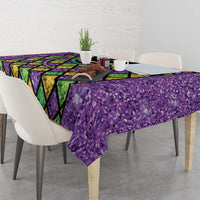 Glitter purple tablecloth with Mardi Gras diamond print and green-yellow-purple bead garland