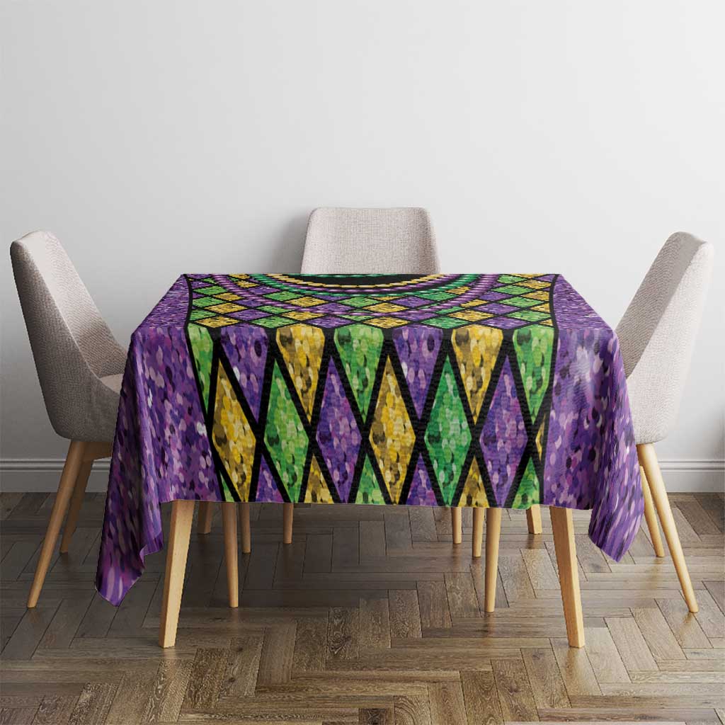 Purple Mardi Gras beaded tablecloth with diamond panels and colorful garland draped across